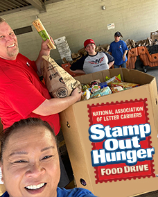 Eagle Staff Showing support on Stamp Out Hunger Food Drive